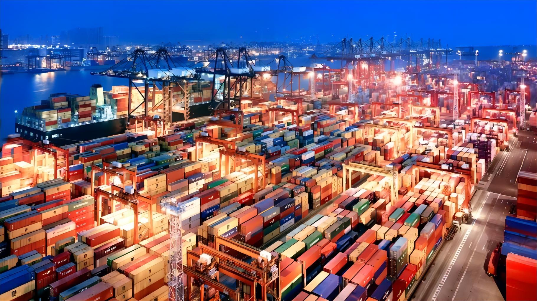 Cargo ships loading at a busy Chinese port for international trade